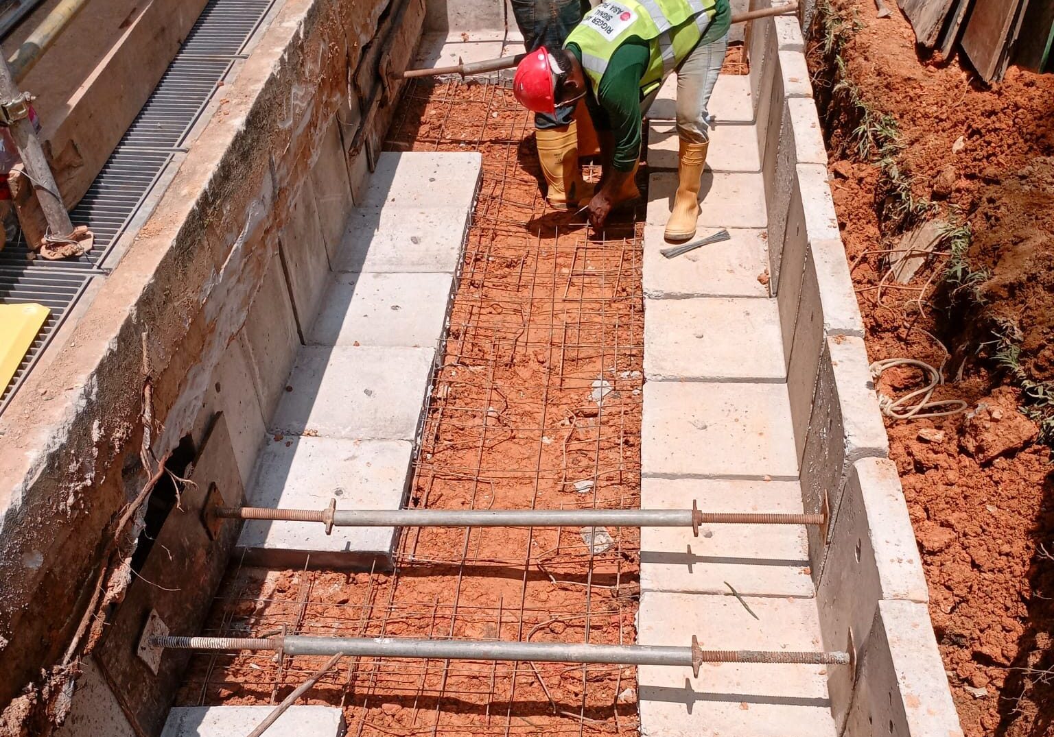 Draw pit construction work for underground cable network installation in Singapore