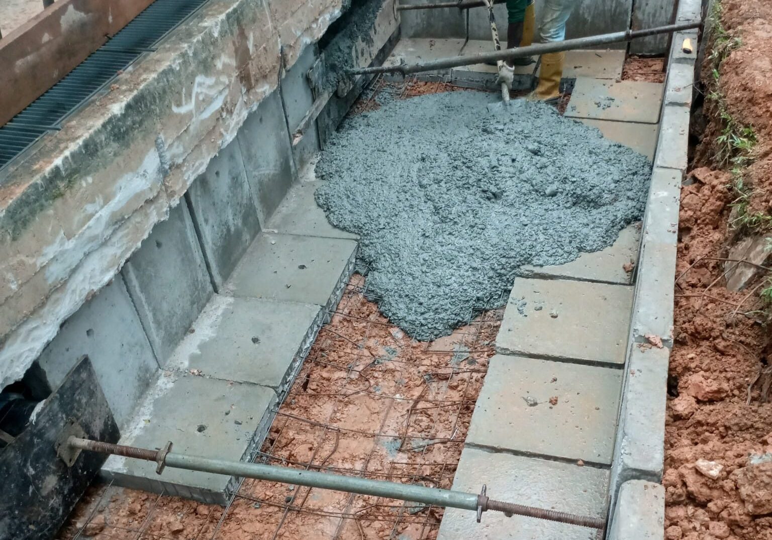 Draw pit construction work for underground cable network installation in Singapore