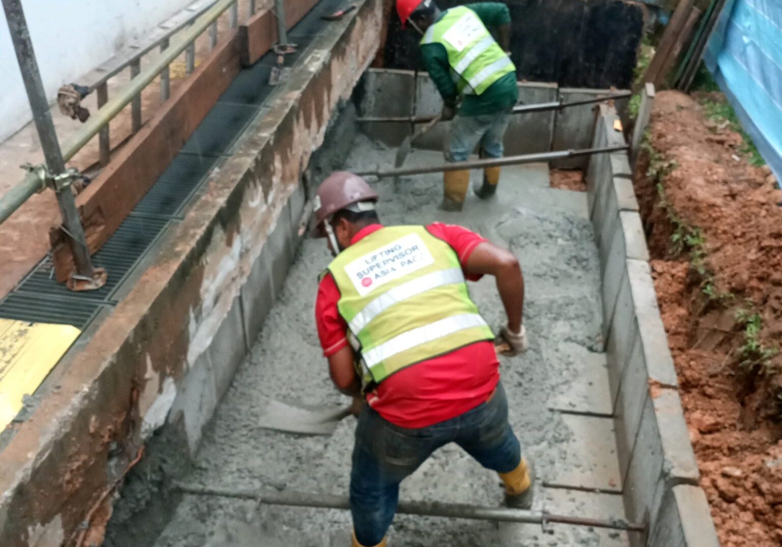 Draw pit construction work for underground cable network installation in Singapore