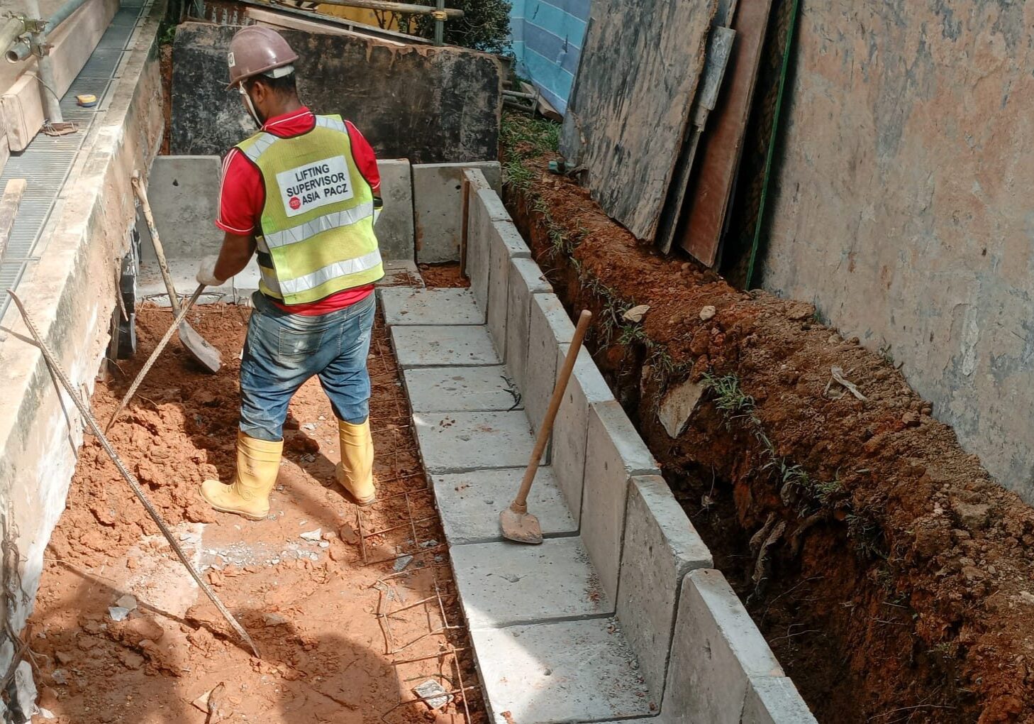 Draw pit construction work for underground cable network installation in Singapore